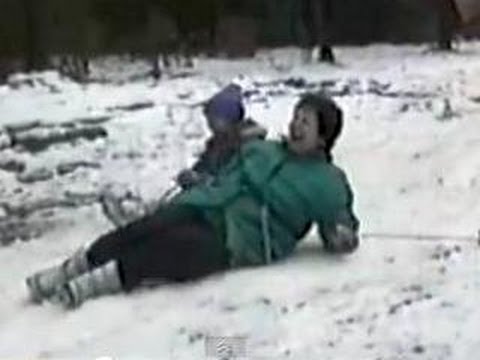 Fat lady falls while Skiing