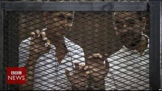 Why did Egypt jail Al Jazeera’s journalists? In 60 seconds – BBC News